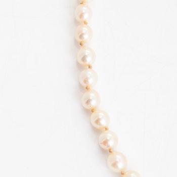 A cultured pearl necklace, clasp with white zircons.