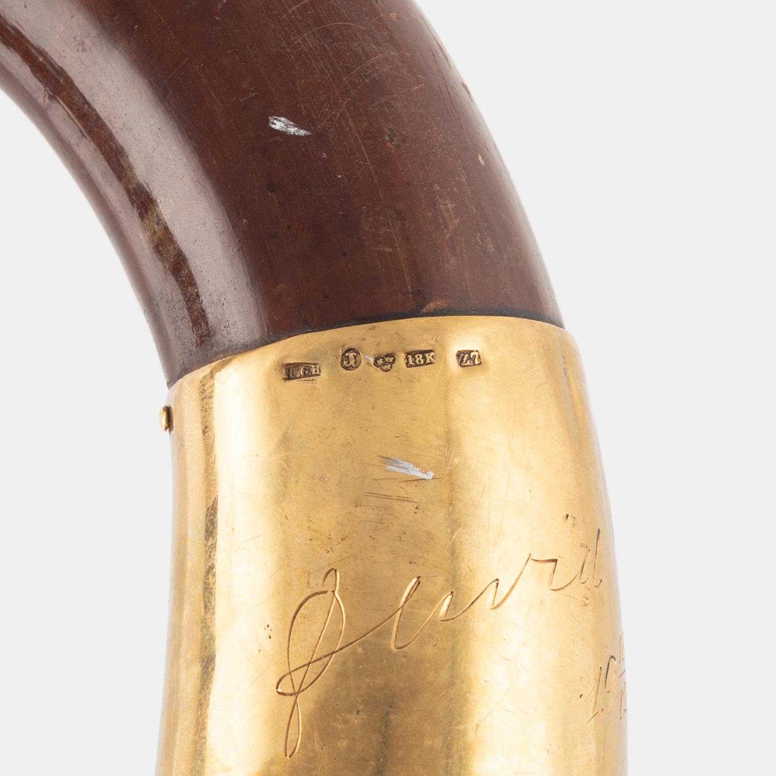 Walking stick, made of wood with upper part 18K gold.
