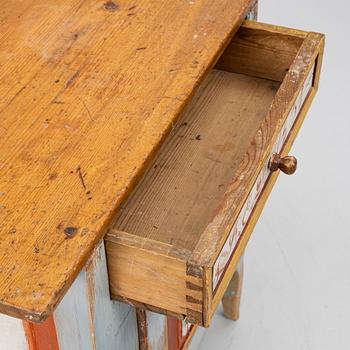 A Swedish folk art polychrome-painted table from Järvsö, Hälsingland, dated 1834.