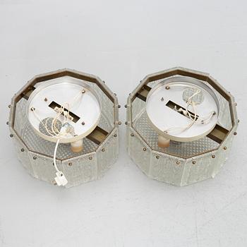 Carl Fagerlund, a pair of glass and brass ceiling lamps, Sweden, second half of the 20th century.