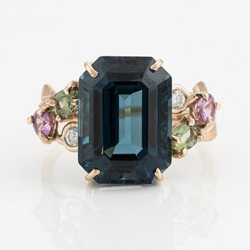 Ring, cocktail ring, with large blue topaz, pink and green tourmalines, and brilliant-cut diamonds.