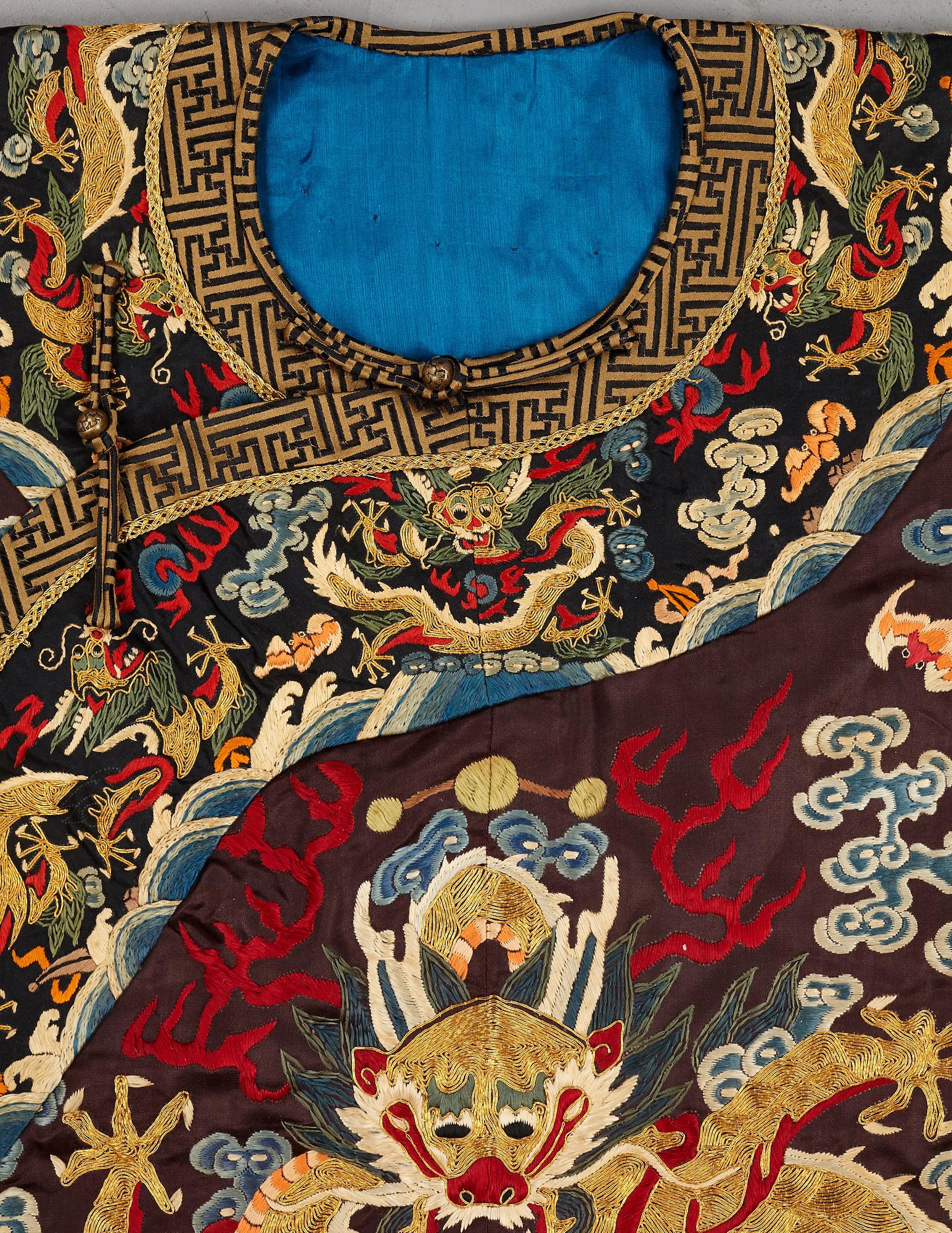 A Chinese embroidered silk robe, late Qing dynasty, circa 1900.