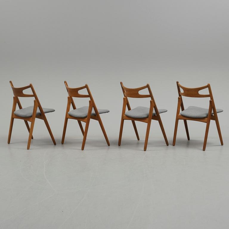 A set of four 'CH 29/Savbukkestolen' by Hans J Wegner, Carl Hansen & Søn, Denmark.