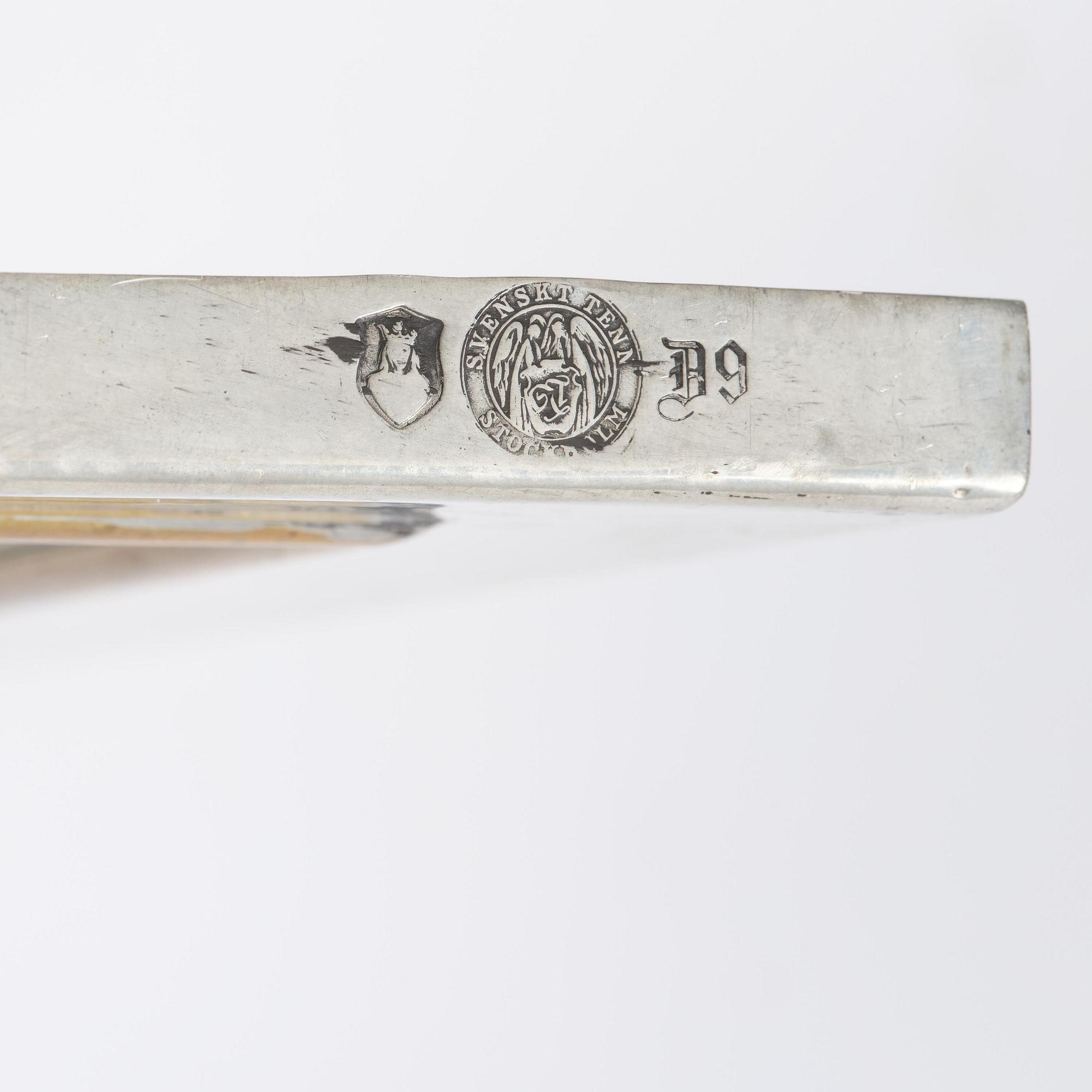 Firma Svenskt Tenn, a pewter and brass wall mirror model 2283, Firma Svenskt Tenn, Stockholm, 1952.