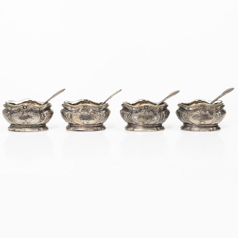 Four French silver salt cellars with spoons, mark of Oilier & Caron,  Paris, 1910-1936.