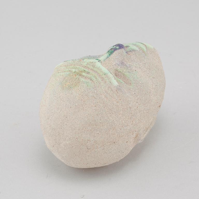 a glass object, signed.