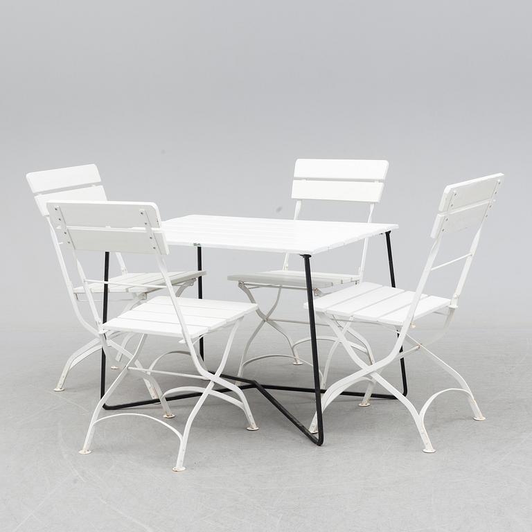 A Garden table with 4 chairs.