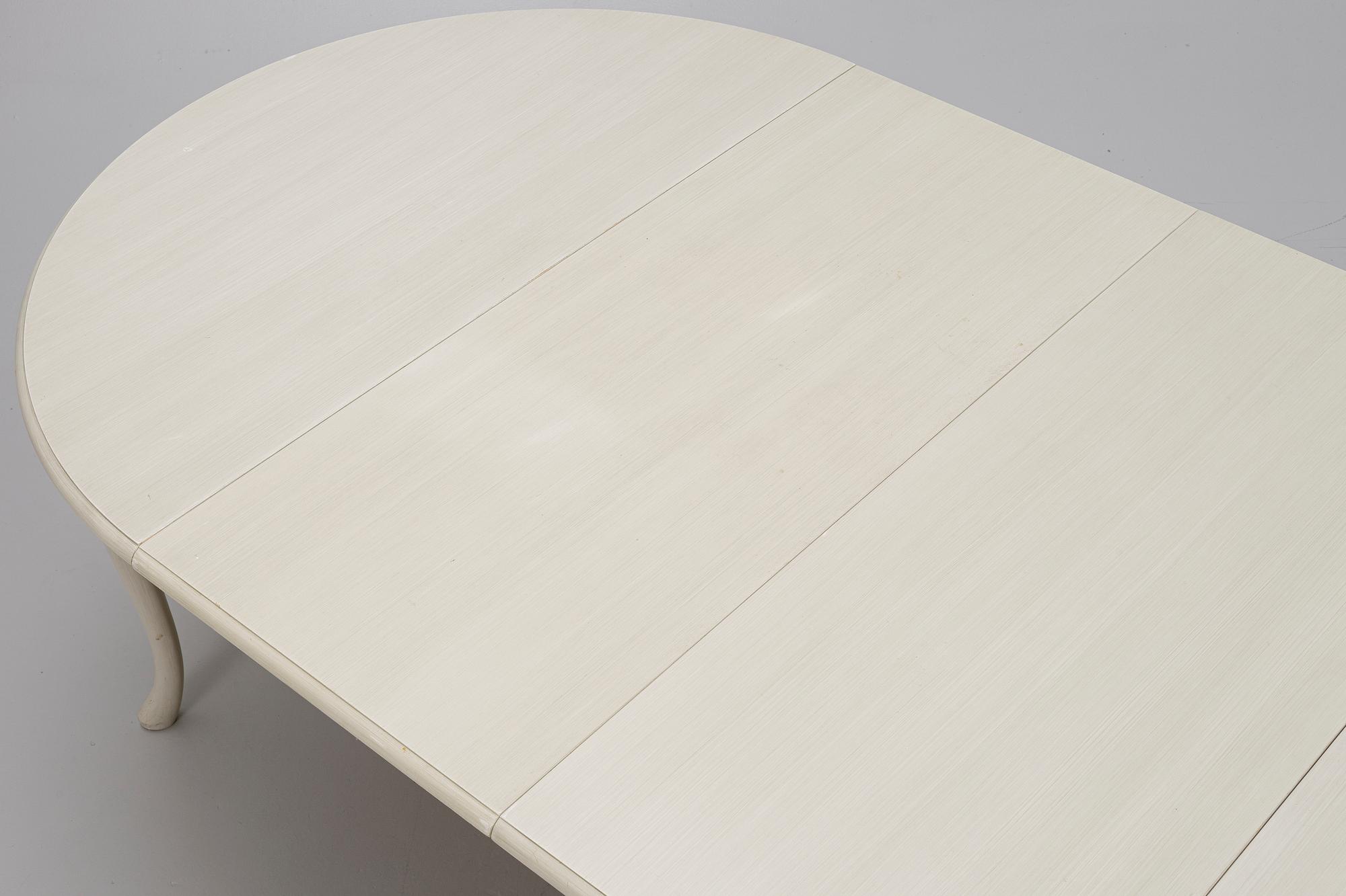 A Rococo style dining table and twelve chairs, KA Roos, Helsingborg, modern production.