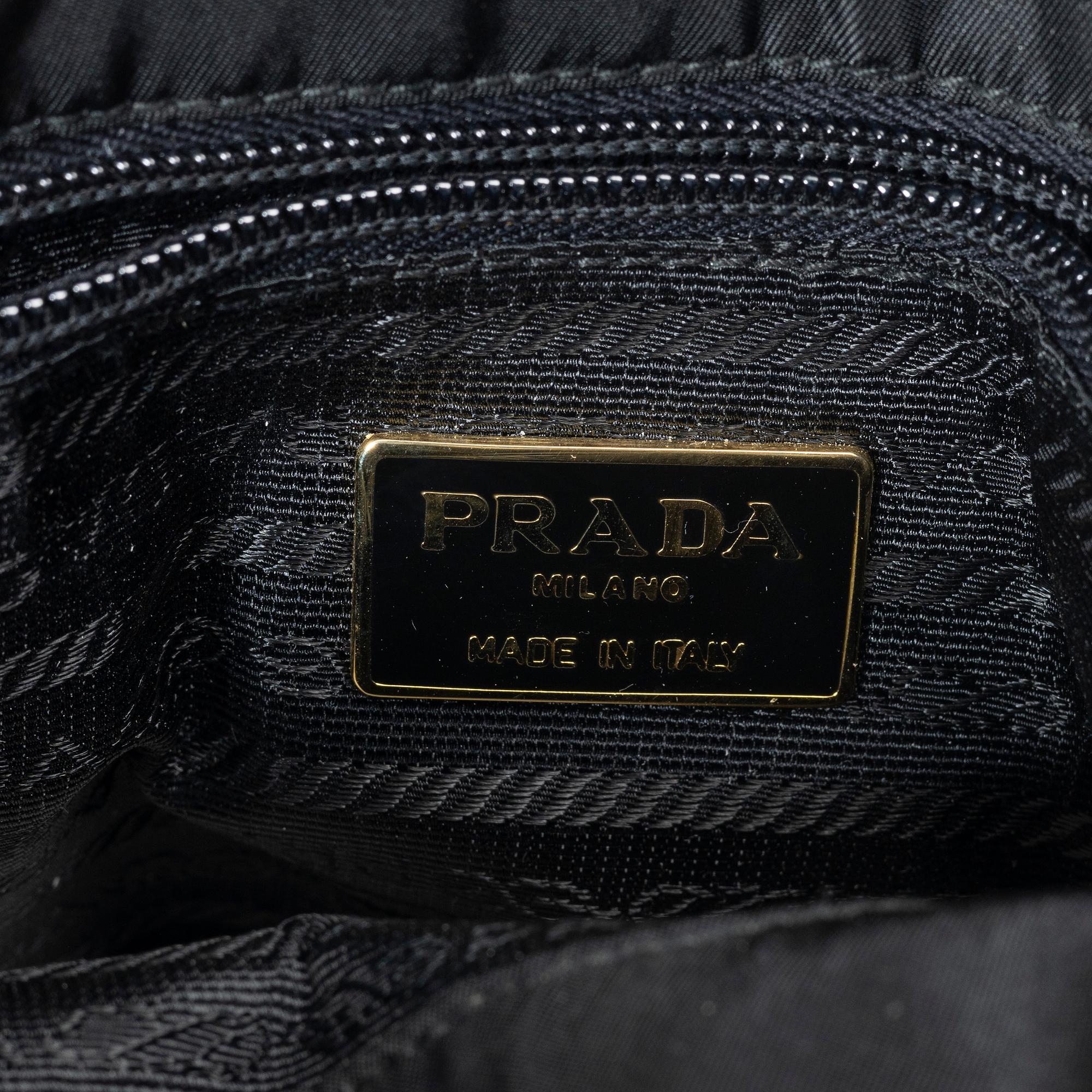 Prada, A black nylon bag.
