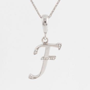 An 18K white gold pendant in the shape of letter F, with diamonds.