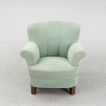 A mid 20th Century sofa and easy chair.