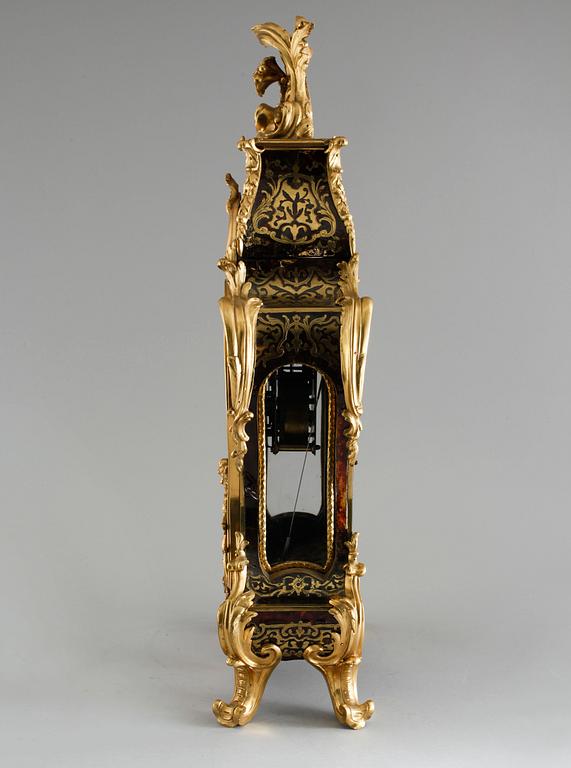 A 19th century mantle clock in the style of Louis XV.