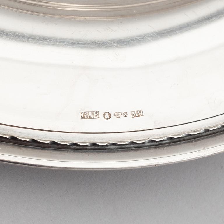 A silver creamer, beaker, and platter, Sweden, 18-19th century.