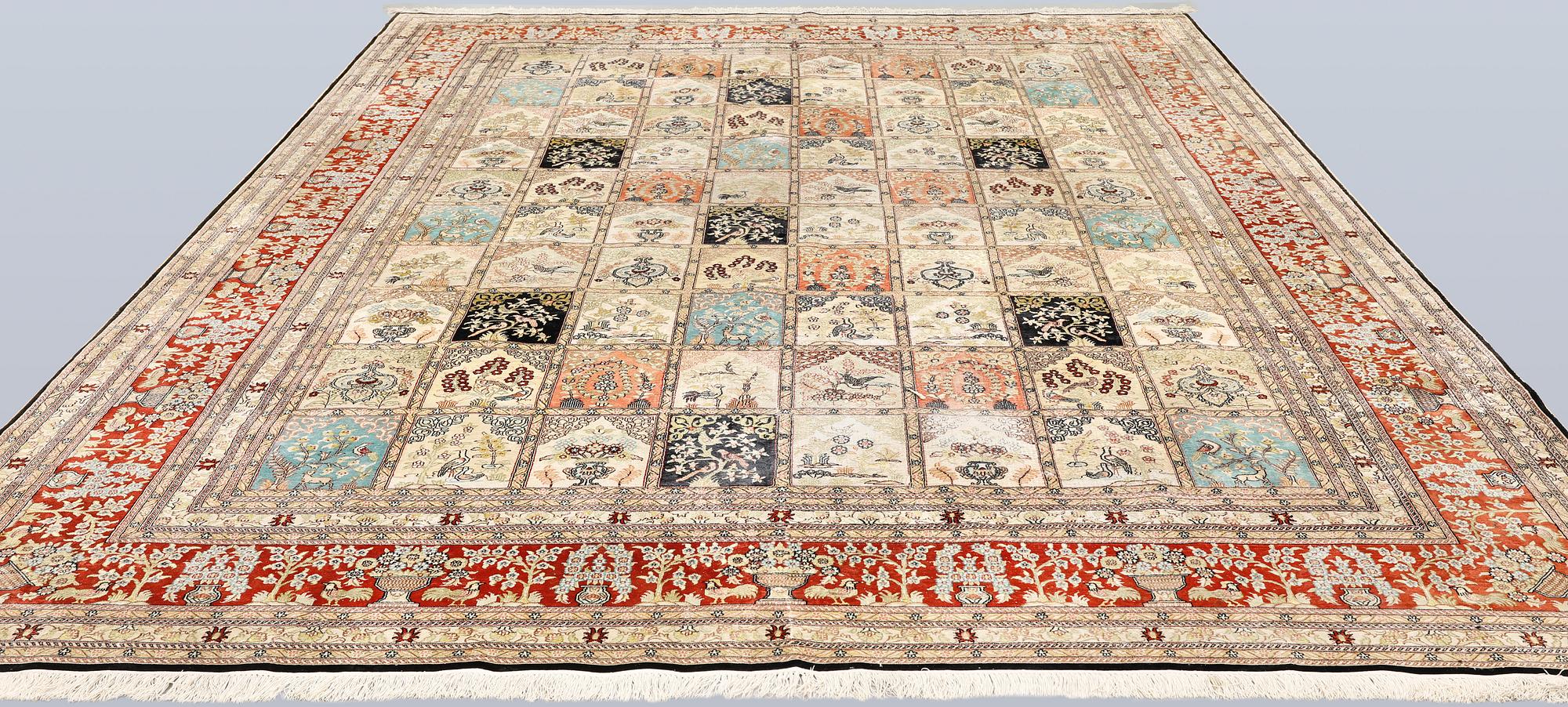 An oriental silk carpet, approx. 376 x 274 cm.