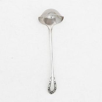 Georg Jensen, a small sterling silver gravy ladle, model "Liljekonvalj"(Lily of the Valley), Copenhagen, Denmark, 1929.