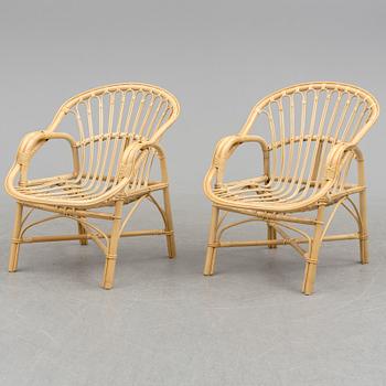 A pair of late 20th century rattan easy chairs.