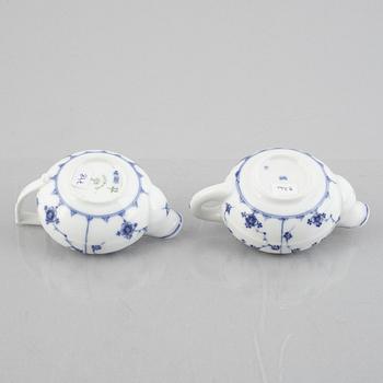 Two 'Musselmalet' porcelain creamers, Royal Copenhagen, one model 55, 19th century.