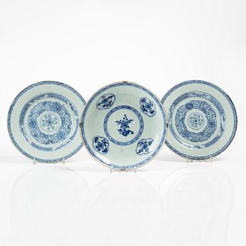 A Chinese blue and white 'anhua' dish and a pair of plates, Qing dynasty, Yongzheng (1723-35).
