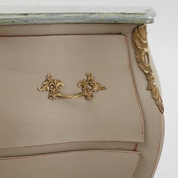 A mid 20th century rococo-style chest of drawers.