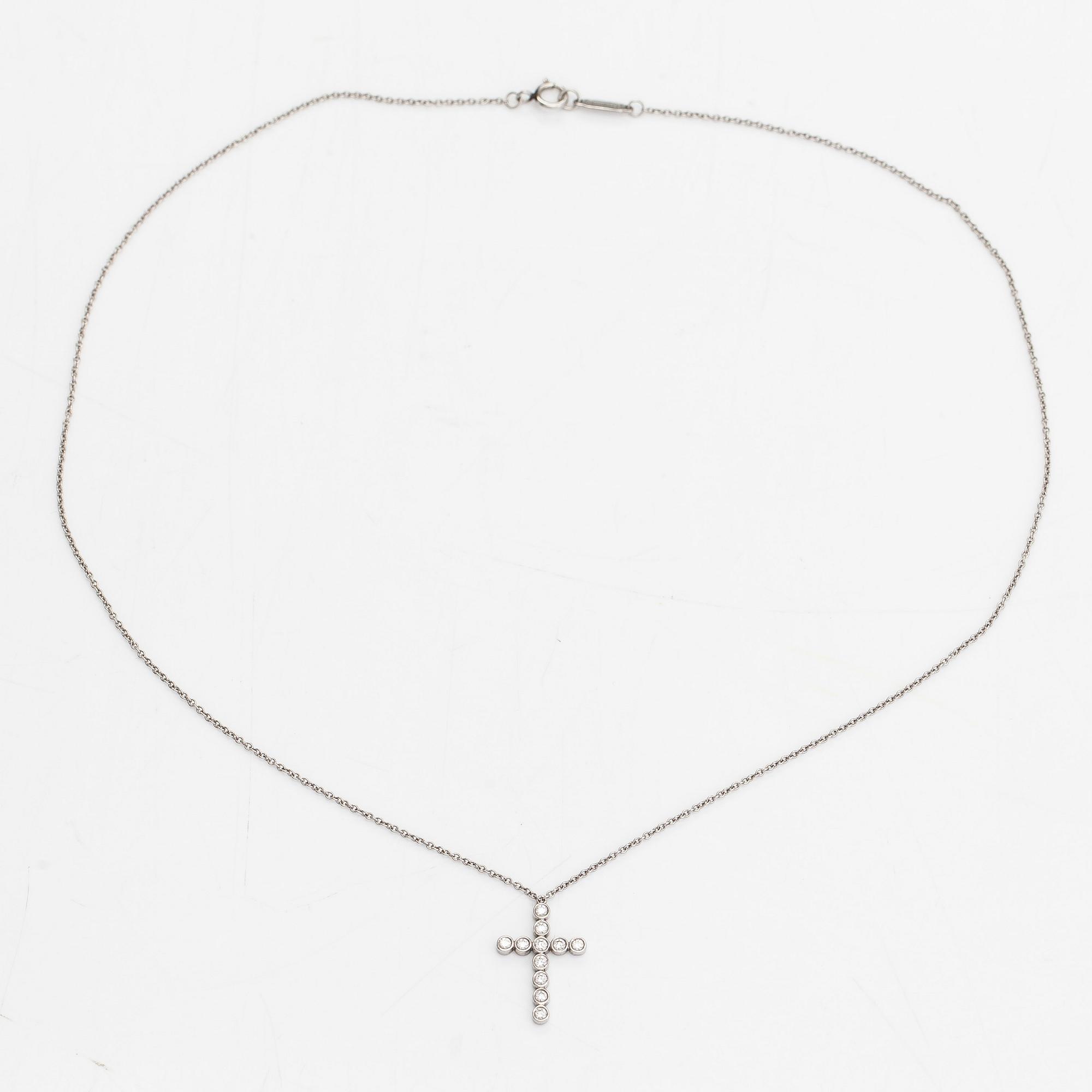 Tiffany & Co, a platinum necklace, 'Jazz Cross' with diamonds approx 0.20ct in total.