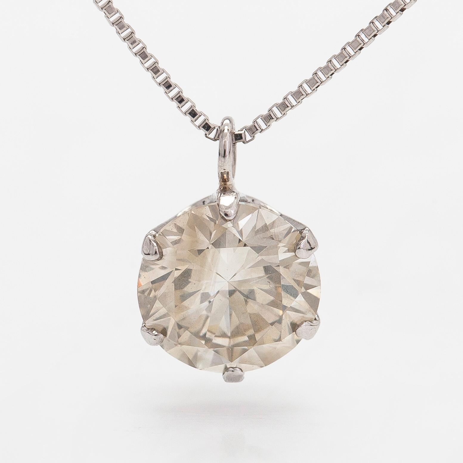 Hänge, platina med briljantslipad diamant ca 1.014 ct enligt gravyr, samt kedja.
