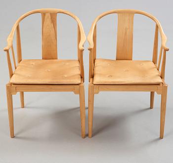 A pair of Hans J Wegner 'China chairs', Fritz Hansen, Denmark 1986-87.