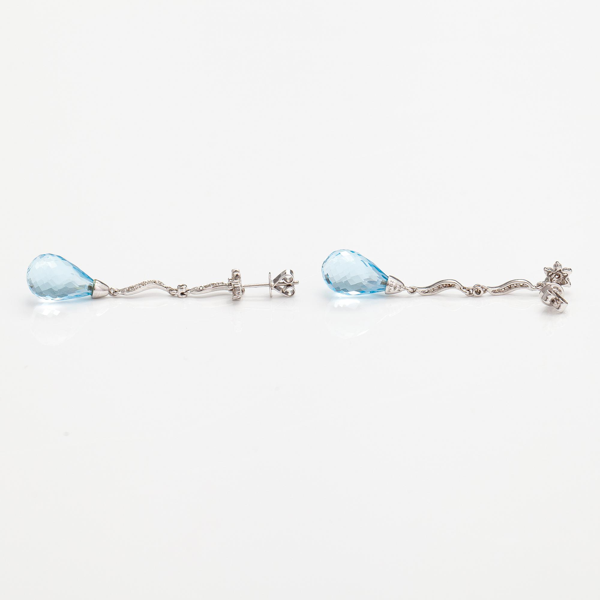 A pair of 18K white gold earrings with topazes and diamonds ca. 0.37 ct in total.