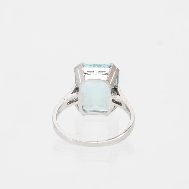 A platinum ring set with a square step cut aquamarin and single cut diamonds CG Hallberg Stockholm 1948.