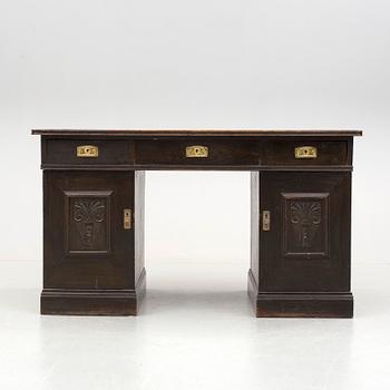 An early 1900s oak writing desk.