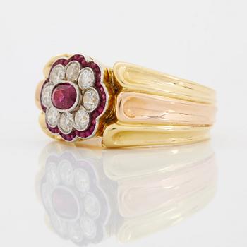 A WA Bolin ring in 18K gold set with rubies and round brilliant-cut diamonds.