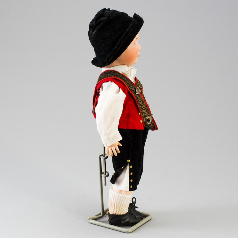 A bisque headed boy doll by Heubach, Germany, 1910s.