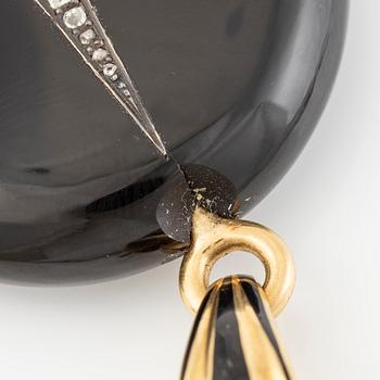 Medallion, 18K gold, onyx, black enamel, and old-cut diamonds, late 19th century.