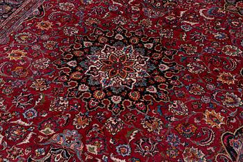 An Oriental carpet, approx. 380 x 304 cm.