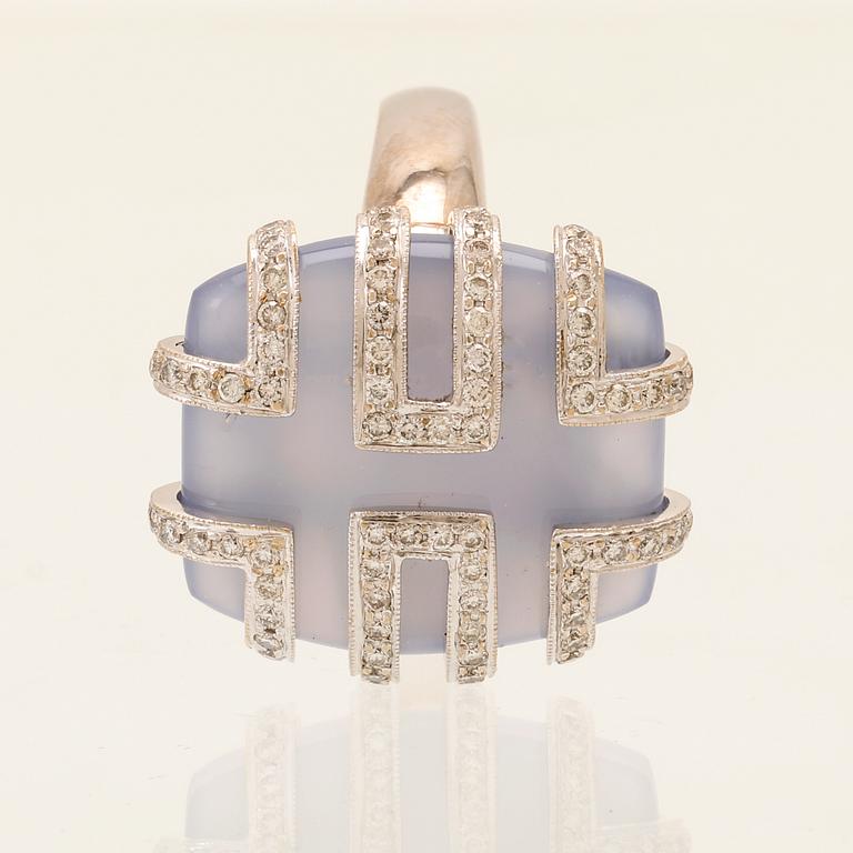 An 18K white gold ring with brilliant cut diamonds and possibly chalcedony.