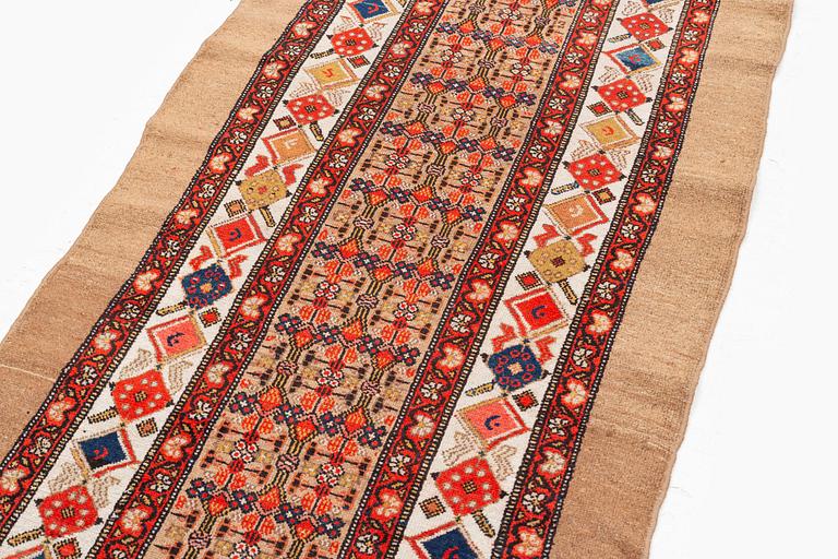 An antique Hamadan runner, northwest Persia c. 422.5 x 93.5 cm.