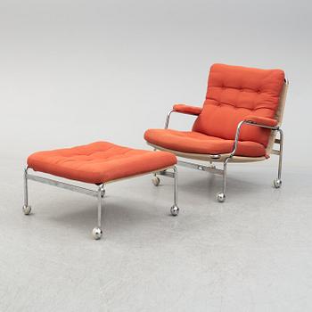 A 'Karin' armchair with stool by Bruno Mathsson for Dux, second half of the 20th century.