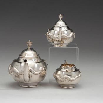 A Chinese three piece silver tea set, early 20th Century.