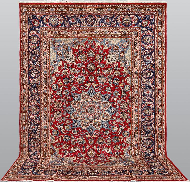 A signed Kashan carpet, ca 313 x 195 cm.
