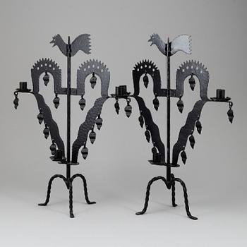 KANDELABRAR , 2 st smide, "Tuppljusstake" Design Gustaf Ancarkrona, Käck & Hedbys, Leksand.