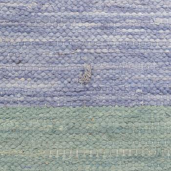 A rag rug, c. 300 x 195 cm.