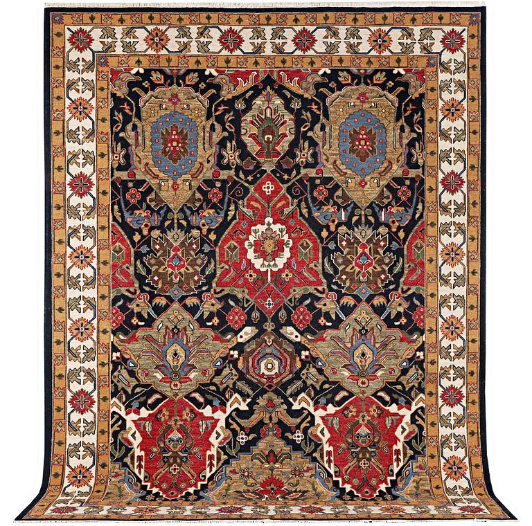 An oriental carpet with Mamluk design, c. 364 x 276 cm.