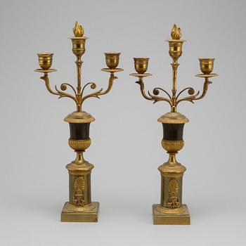 A pair of Empire bronze candelabra, first half of the 19th century.