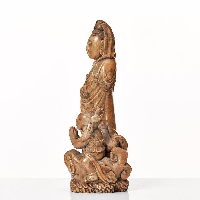 A soapstone sculpture of Guanyin with an attendant, Qing dynasty.