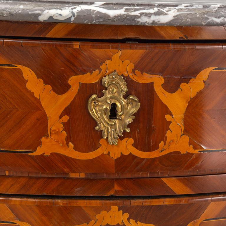 A French Louis XV marquetry and gilt-bronze mounted commode 'Aux bustes de femmes", later part of the 18th century.