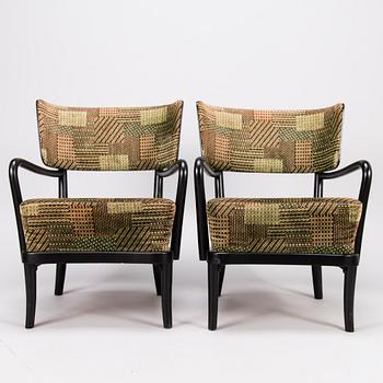 A mid-20th Century pair of armchairs.