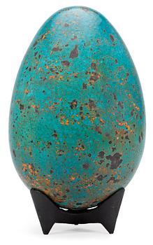 1311. A Hans Hedberg faience egg on an iron stand, Biot, France.