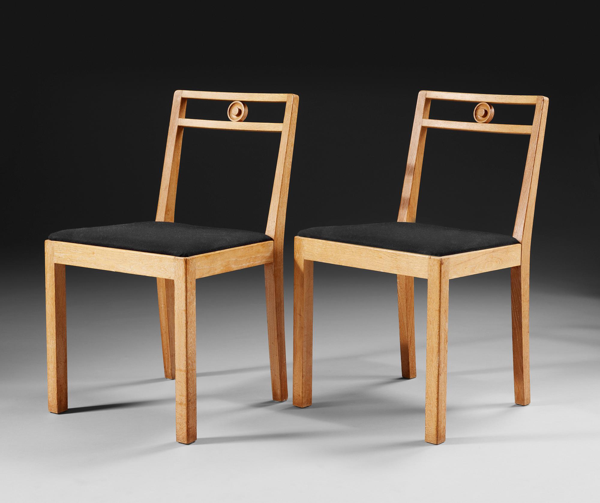 A pair of Axel-Einar Hjorth white chalked oak chairs 'Dagmar' by NK, Sweden 1935.