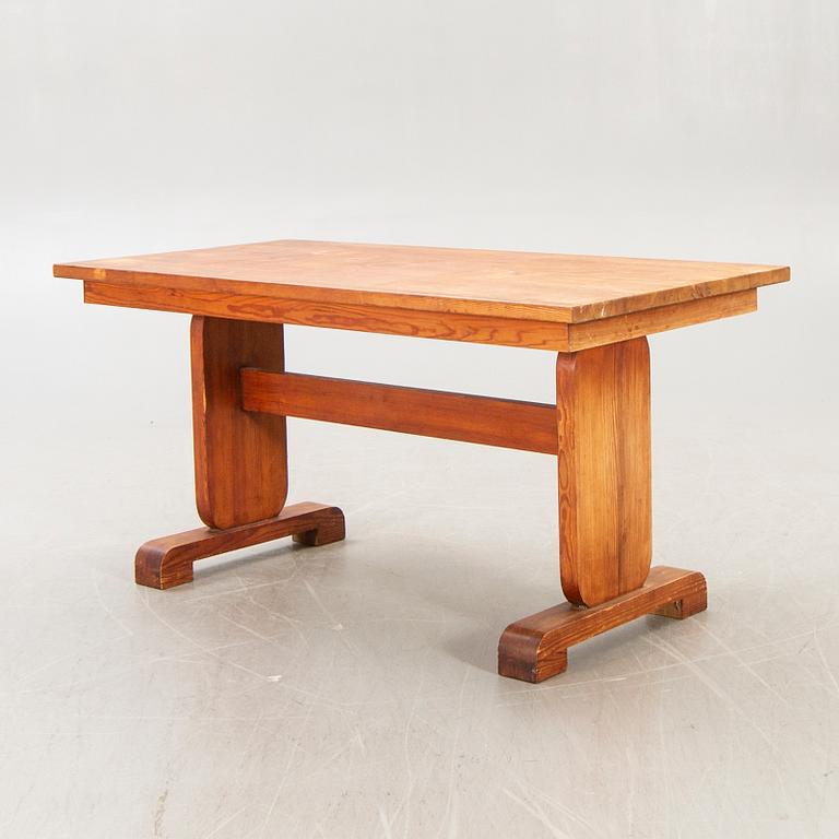 A 1940s pine dining table.