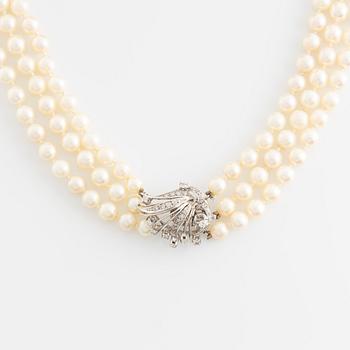 Cultured pearl necklace, three strand, calibrated, clasp with diamonds.