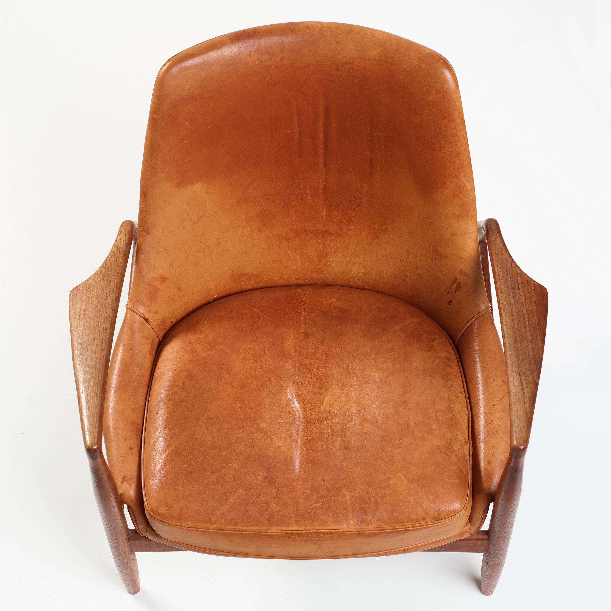 Ib Kofod-Larsen, a "Seal" teak and brown leather armchair, Olof Persson Möbler, Jönköping, Sweden 1950-60's.